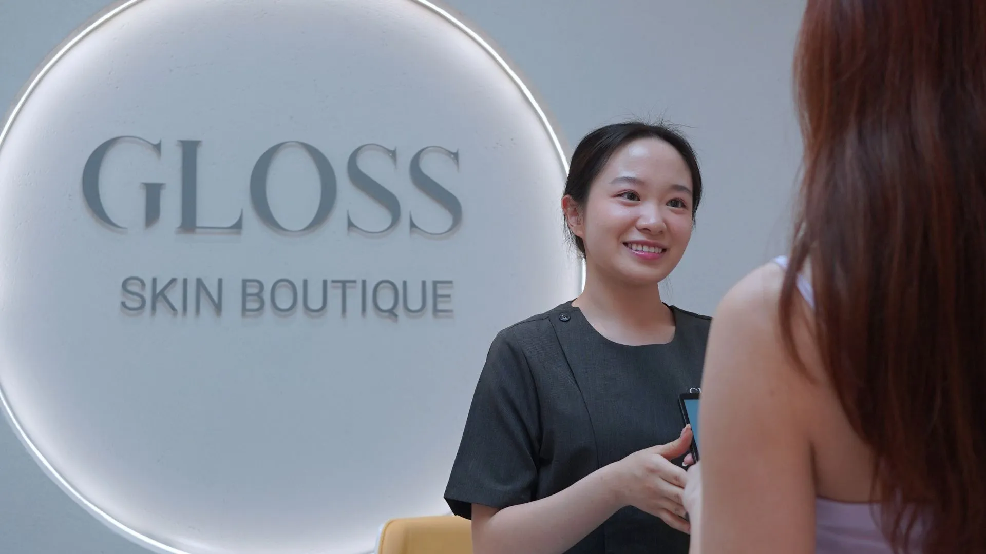 Gloss Skin Boutique Front Counter Before and After Background Image